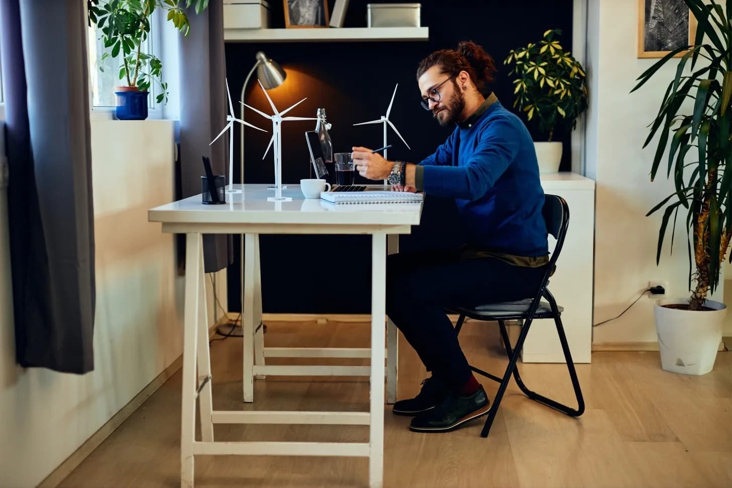 Software developer working at his desk representing he was working on a timeline