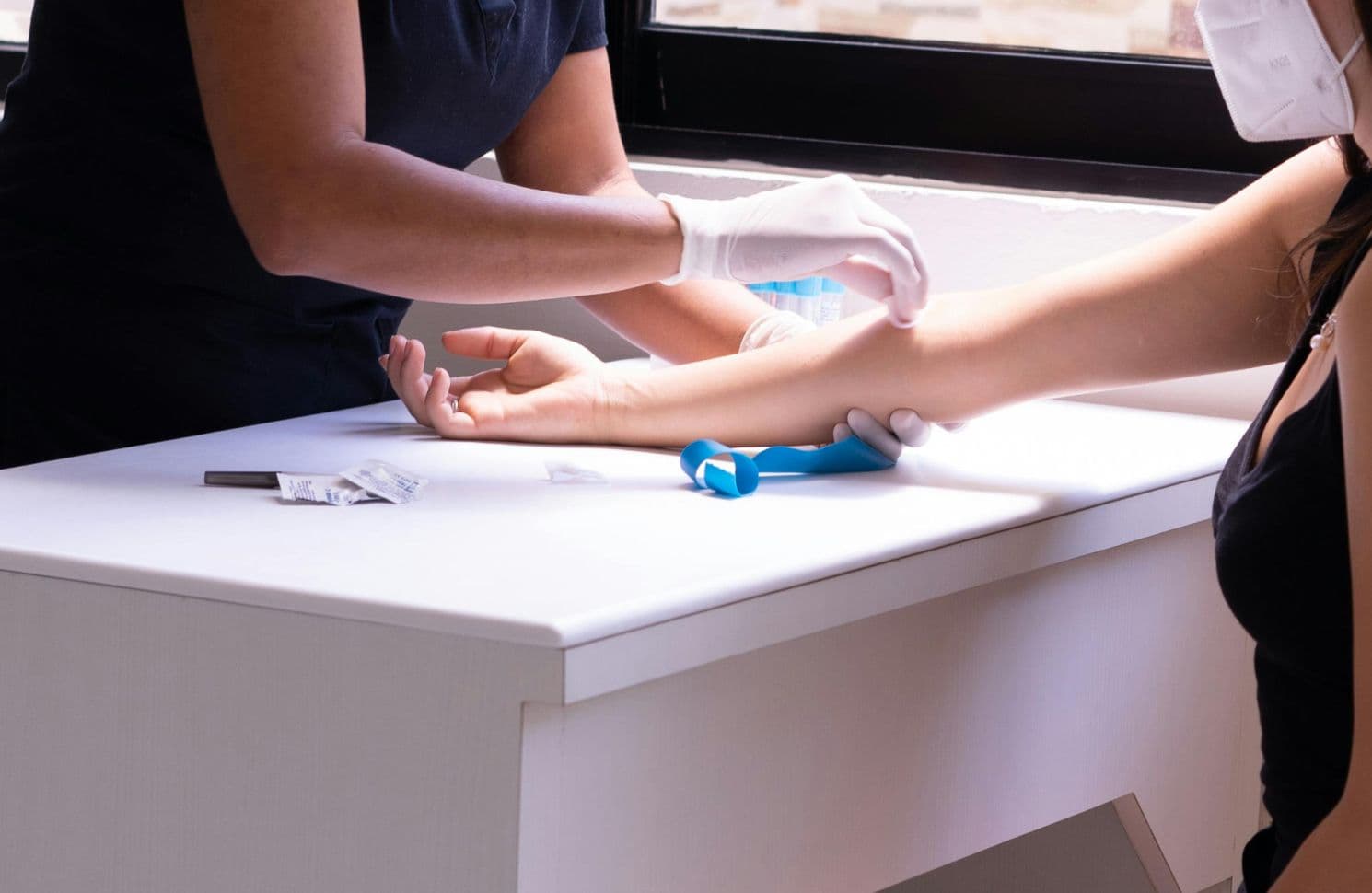 Nurse taking blood from a patient