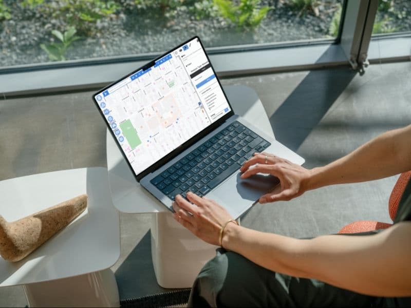 Person looking at a SaaS application dashboard on their laptop