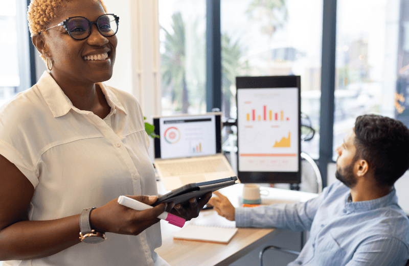 female developer smiling with coworker
