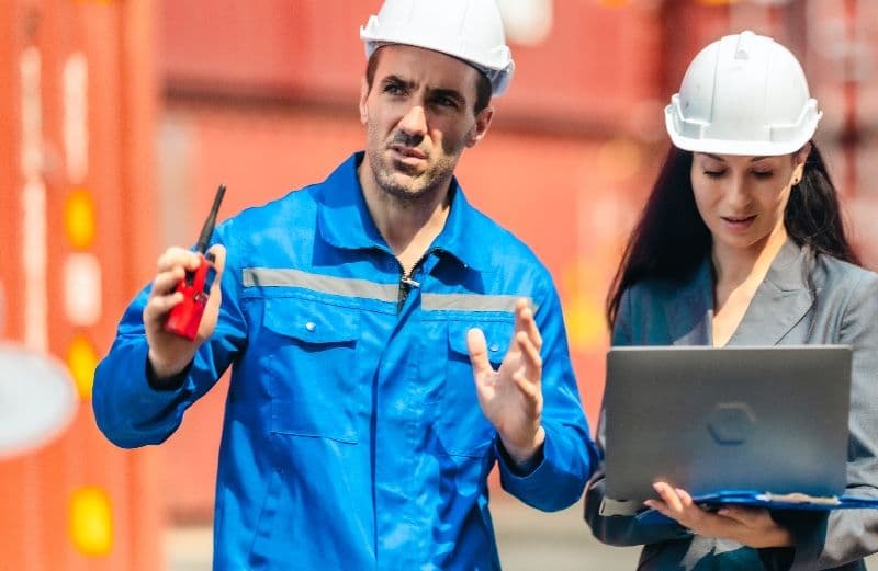 freight logistics workers with hard hats